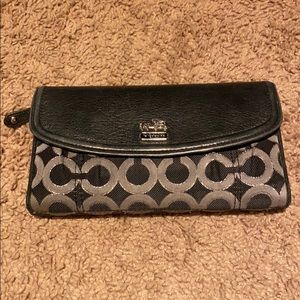 Black and silver coach wallet